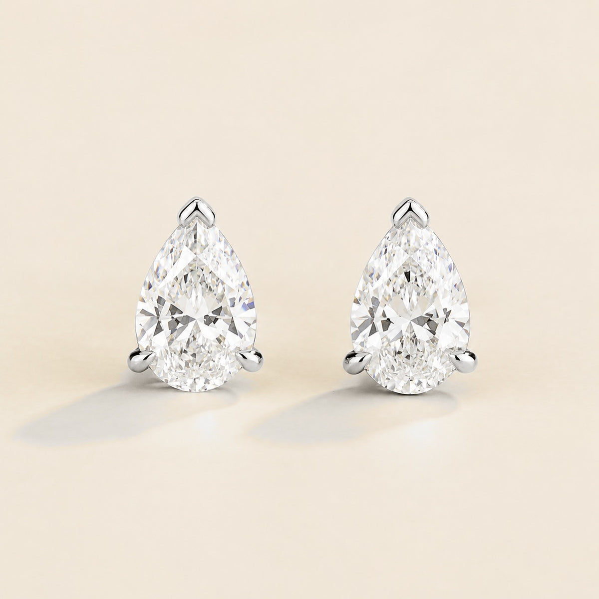 Pandal pear lab-grown diamond solitaire stud earrings in white gold – front view | Juvetti