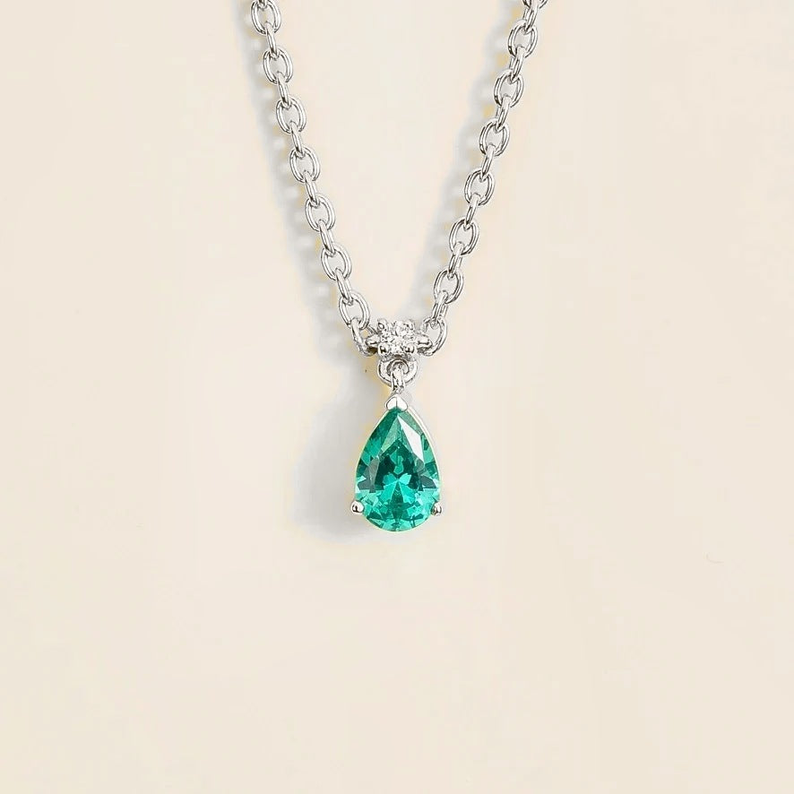 Lab-grown Paraiba sapphire and diamond pear drop pendant necklace in white gold, small – front view | Pisa by Juvetti