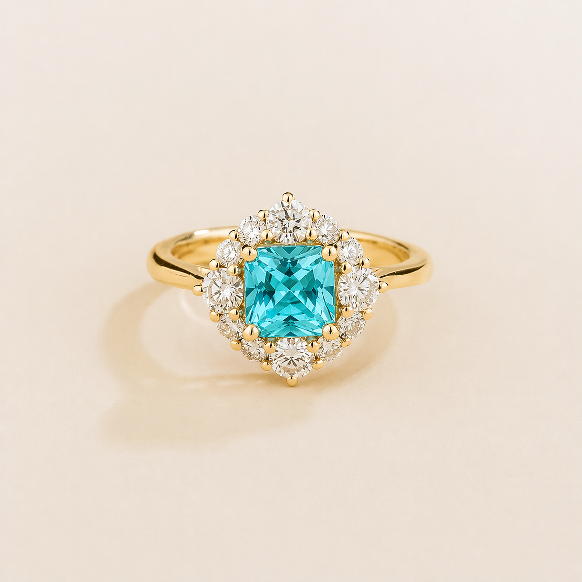Tuli cushion-cut lab-grown Paraiba Sapphire and diamond halo ring in gold – front view | Juvetti London