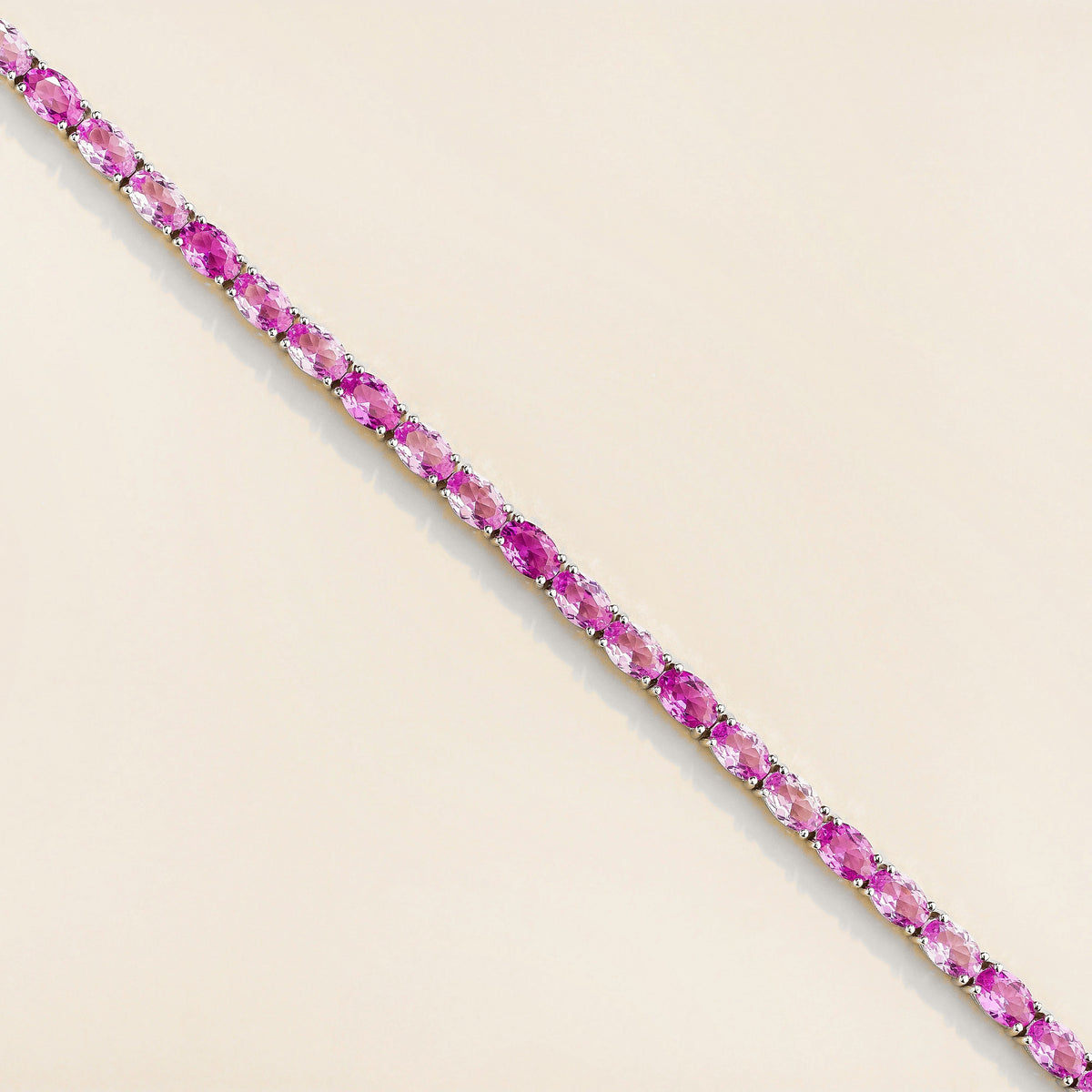 Salto Pastel Pink Sapphire Oval Tennis Bracelet in White Gold