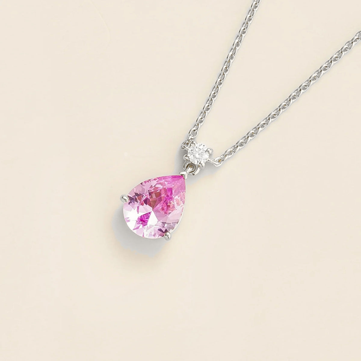 Lab-grown pastel pink sapphire and diamond pear drop pendant necklace in white gold, medium – angled view | Pisa by Juvetti