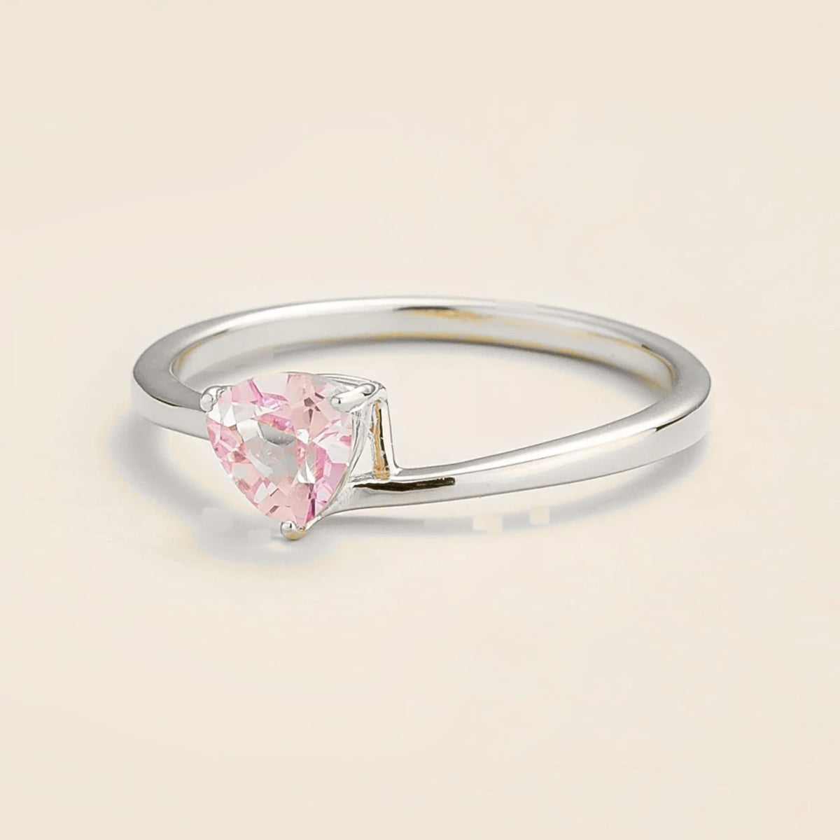 Trillion Pastel Pink Sapphire Solitaire Ring in White Gold on neutral background
