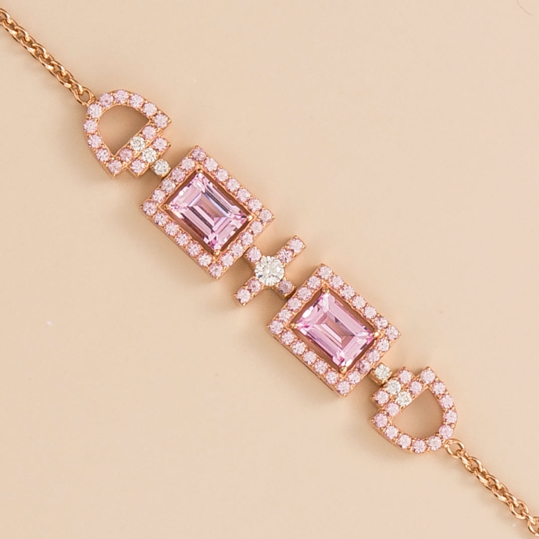Ciceris pink sapphire Art Deco halo bracelet in rose gold, two emerald-cut lab-grown sapphires with diamonds, close-up | Juvetti London