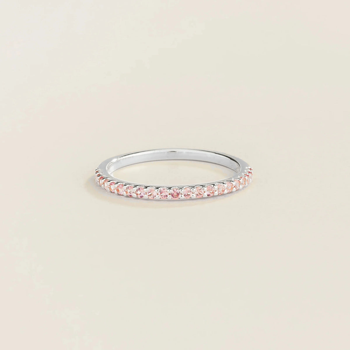 Juvetti white gold half eternity band set with round lab-grown pink sapphires.
