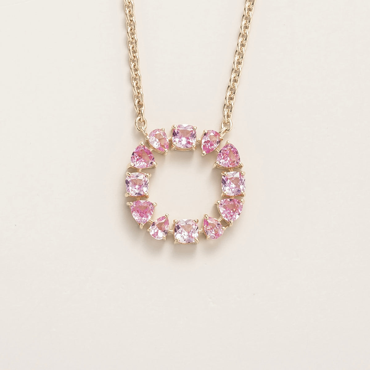 Glorie pink sapphire open circle pendant necklace in white gold, mixed-cut lab-grown sapphires, front view | Juvetti London