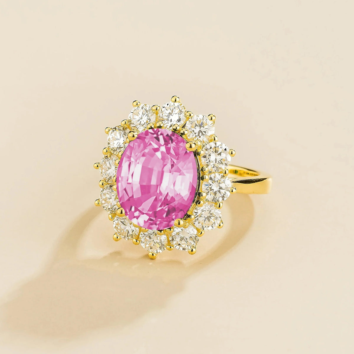 Oval Pink Sapphire & Diamond Halo Ring in Gold