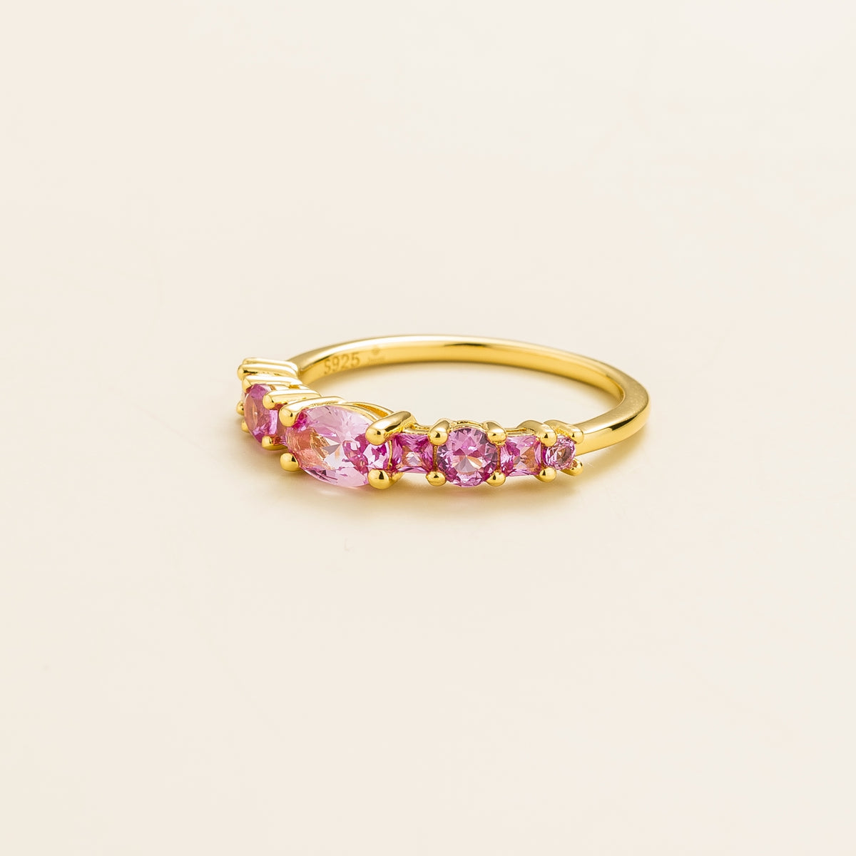 Petra Pink Sapphire Graduated Band Ring in Gold – angle view