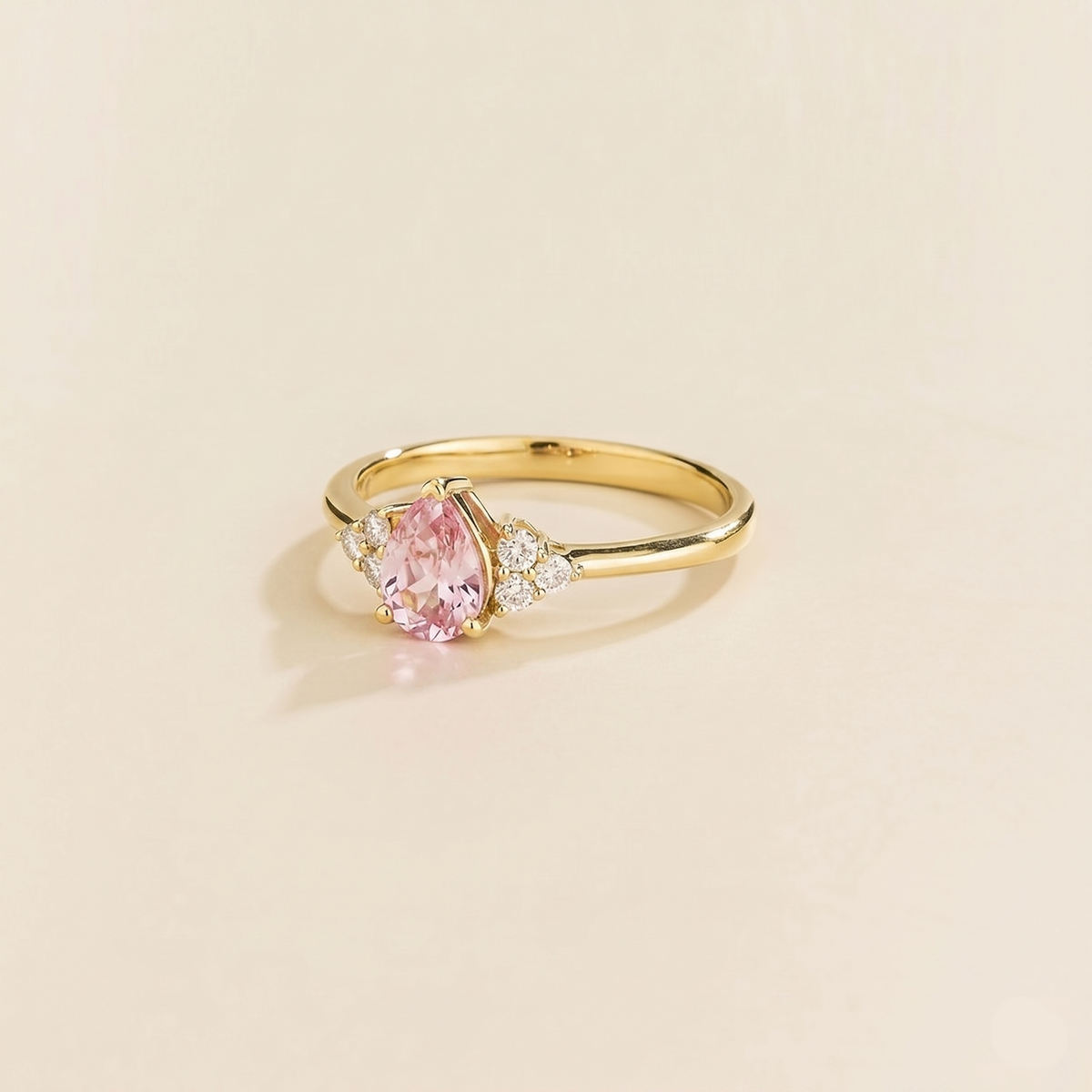 Pear-cut lab-grown pink sapphire and diamond ring in gold – side view | Pisa by Juvetti