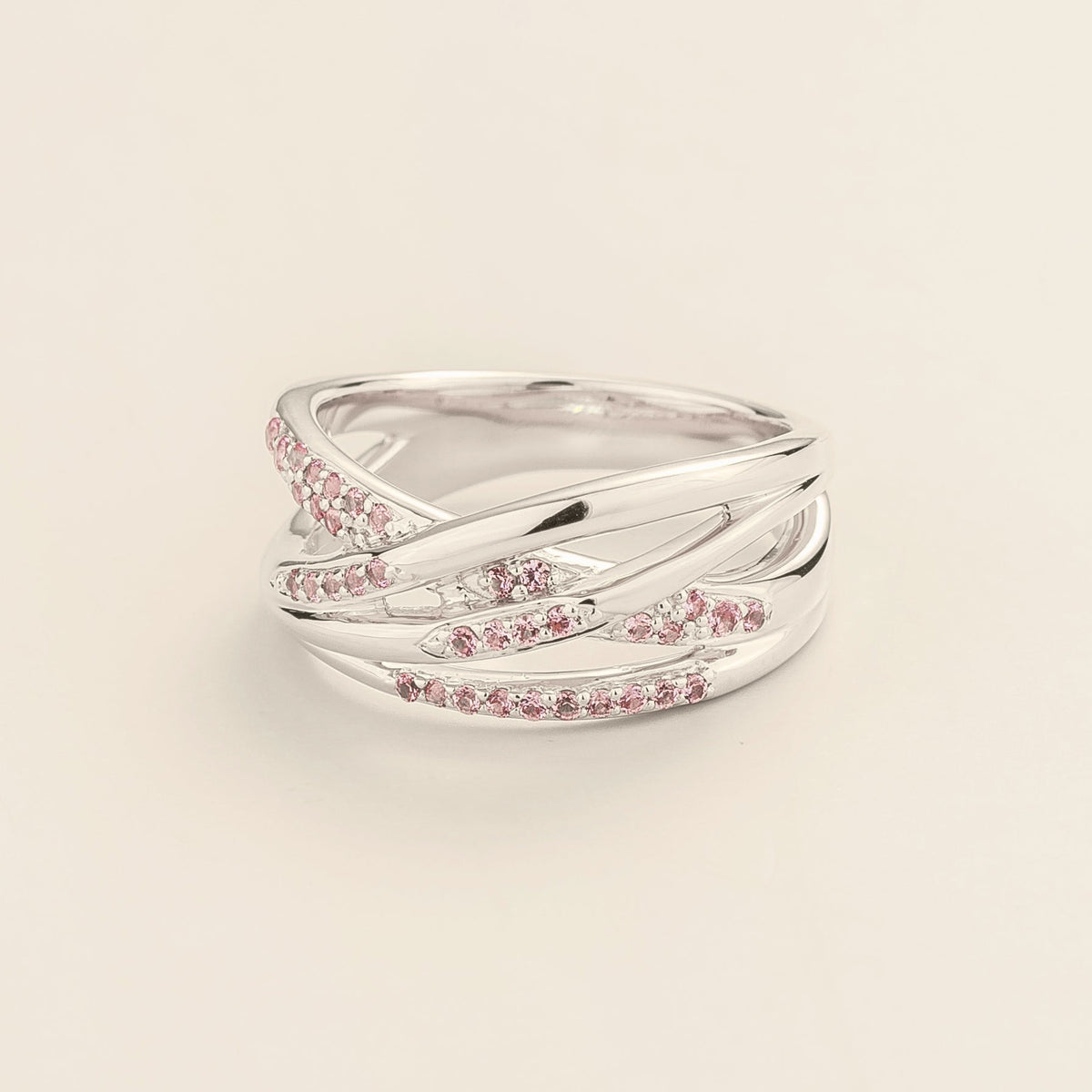 Val multi-row crossover band ring with lab-grown pink sapphires in white gold – angle view | Juvetti London