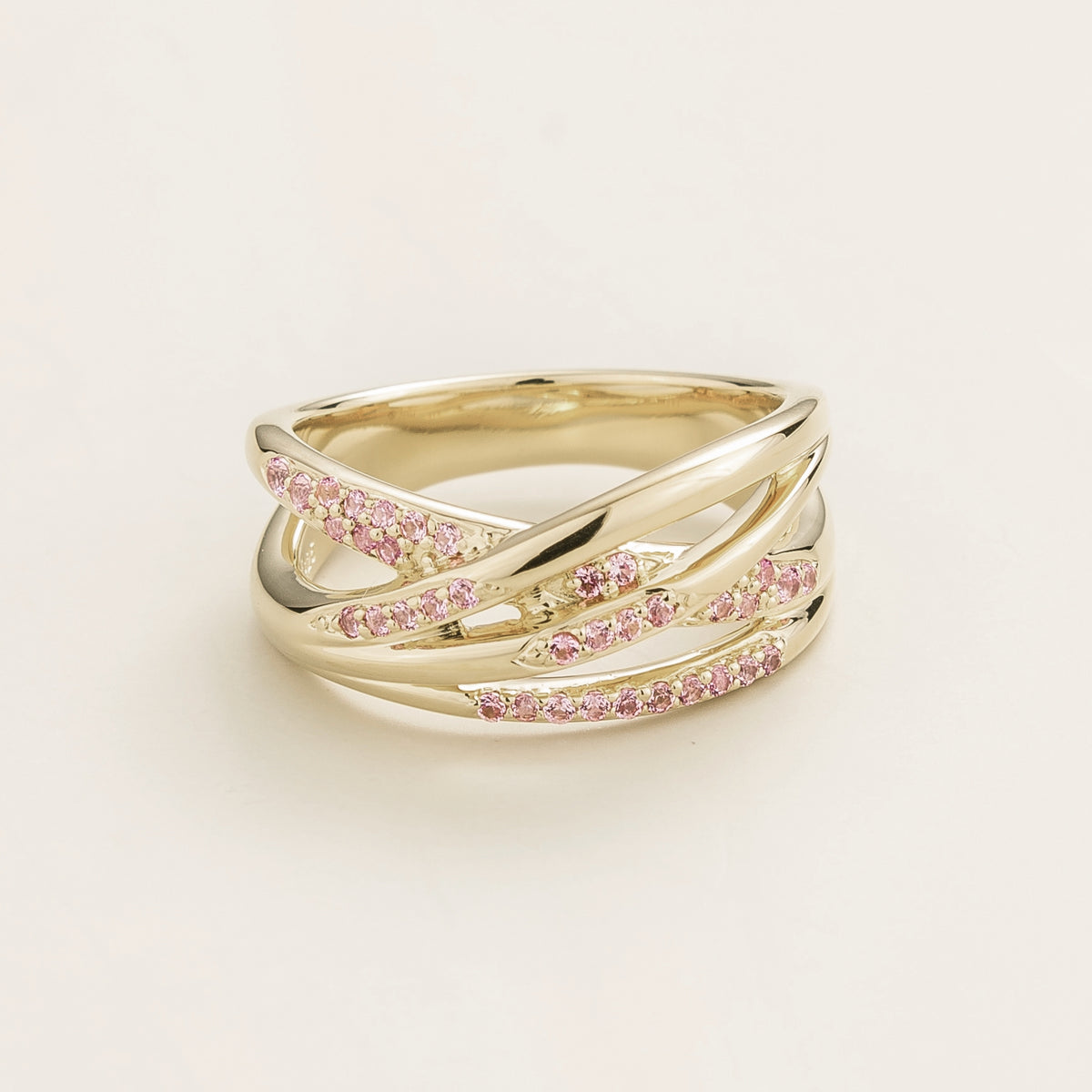 Val multi-row crossover band ring with lab-grown pink sapphires in white gold – front view | Juvetti London