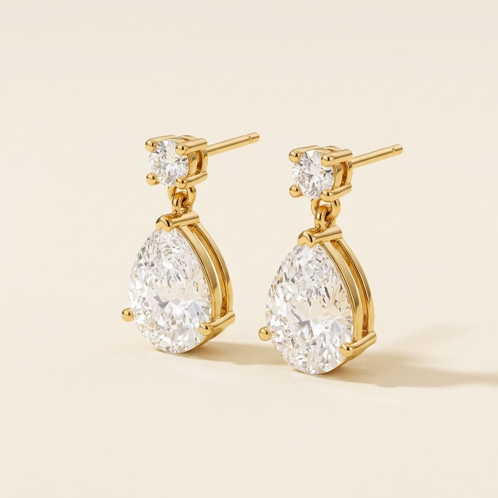Pisa Diamond Pear Drop Earrings in Gold – Medium – angle view | Juvetti