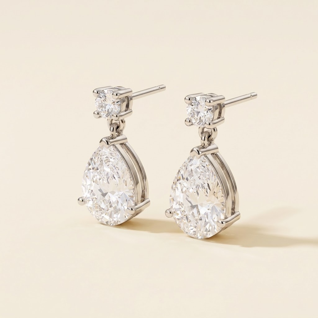 Pisa Diamond Pear Drop Earrings in White Gold – Medium – angle view | Juvetti