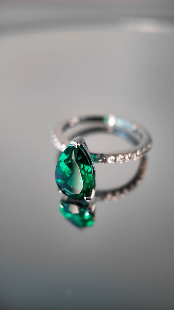 Ostry Pear-Cut Emerald and Diamond Pavé Shoulder Solitaire Ring in White Gold