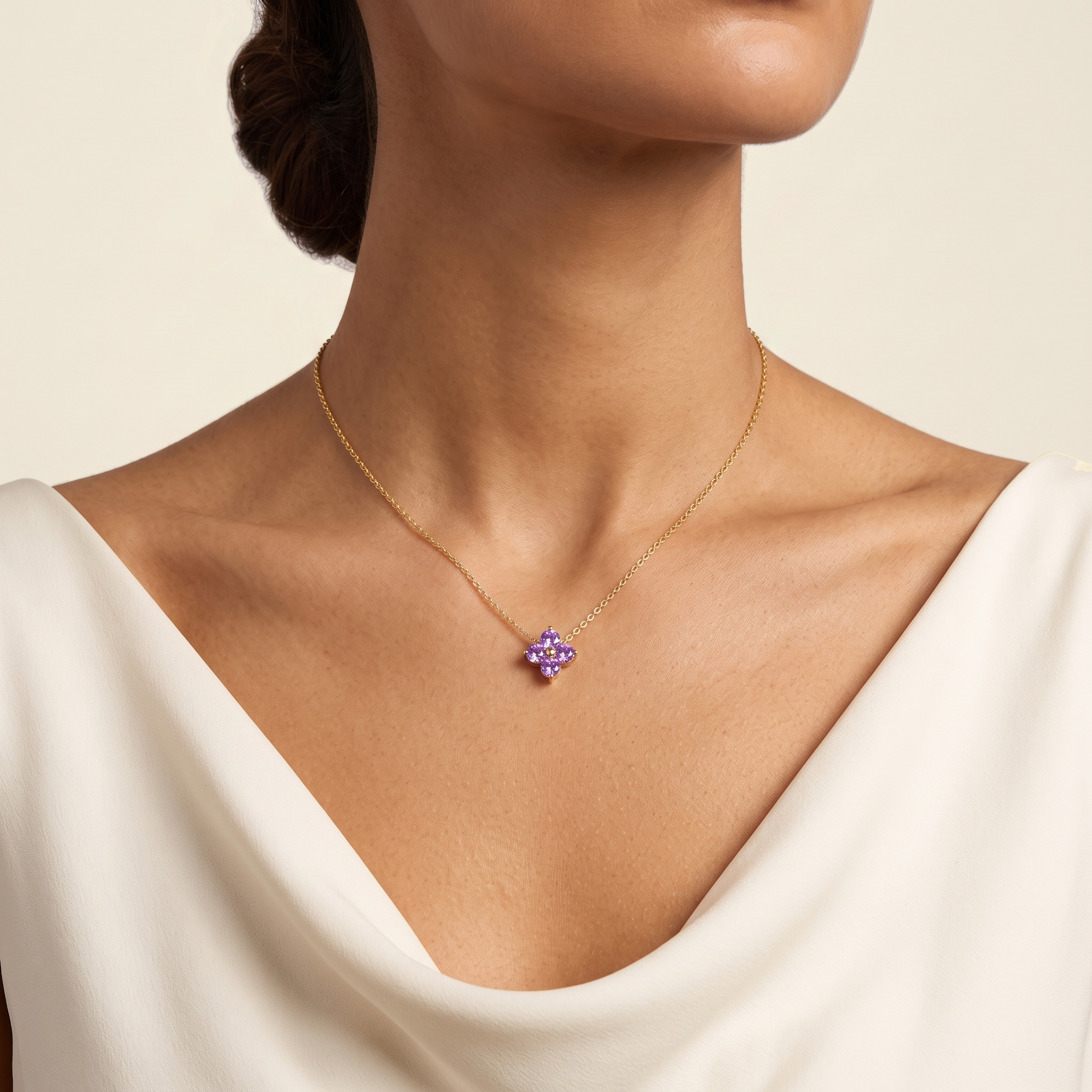 Model wears the Clover round purple sapphire pendant necklace in gold