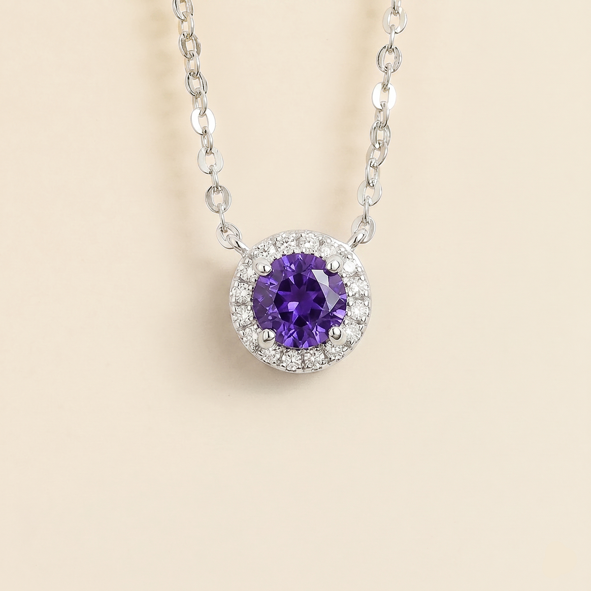 Front view of the Mars Purple Sapphire Round & Diamond Halo Necklace In White Gold, handcrafted by Juvetti London