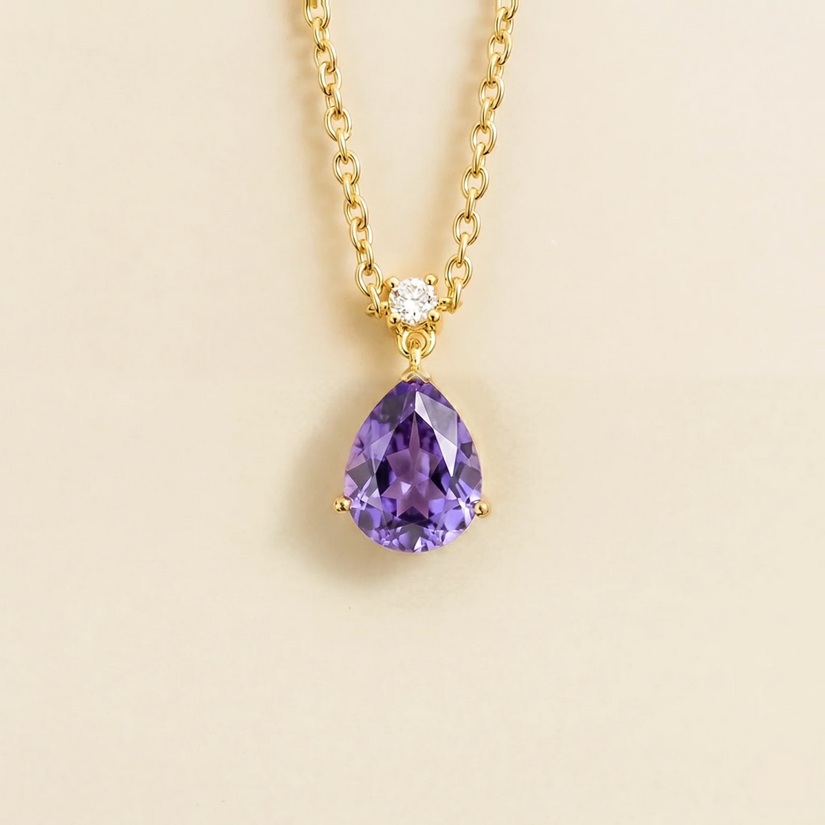Lab-grown purple sapphire and diamond pear drop pendant necklace in gold, medium – front view | Pisa by Juvetti