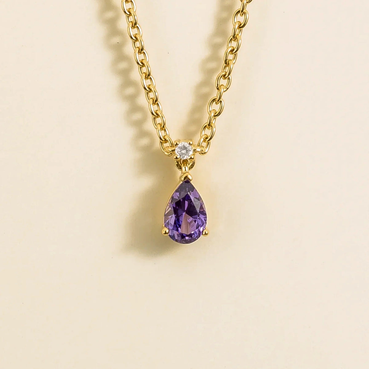 Lab-grown purple sapphire and diamond pear drop pendant necklace in gold, small – front view | Pisa by Juvetti