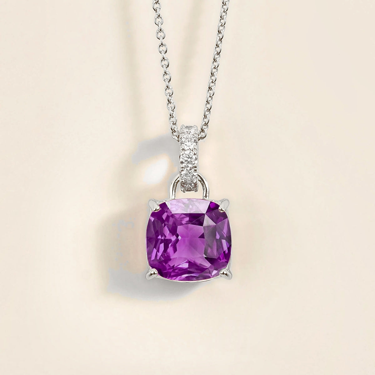 Front view of the Roue Purple Sapphire Cushion Cut & Diamond Hoop Pendant Necklace in White Gold, handcrafted by Juvetti London