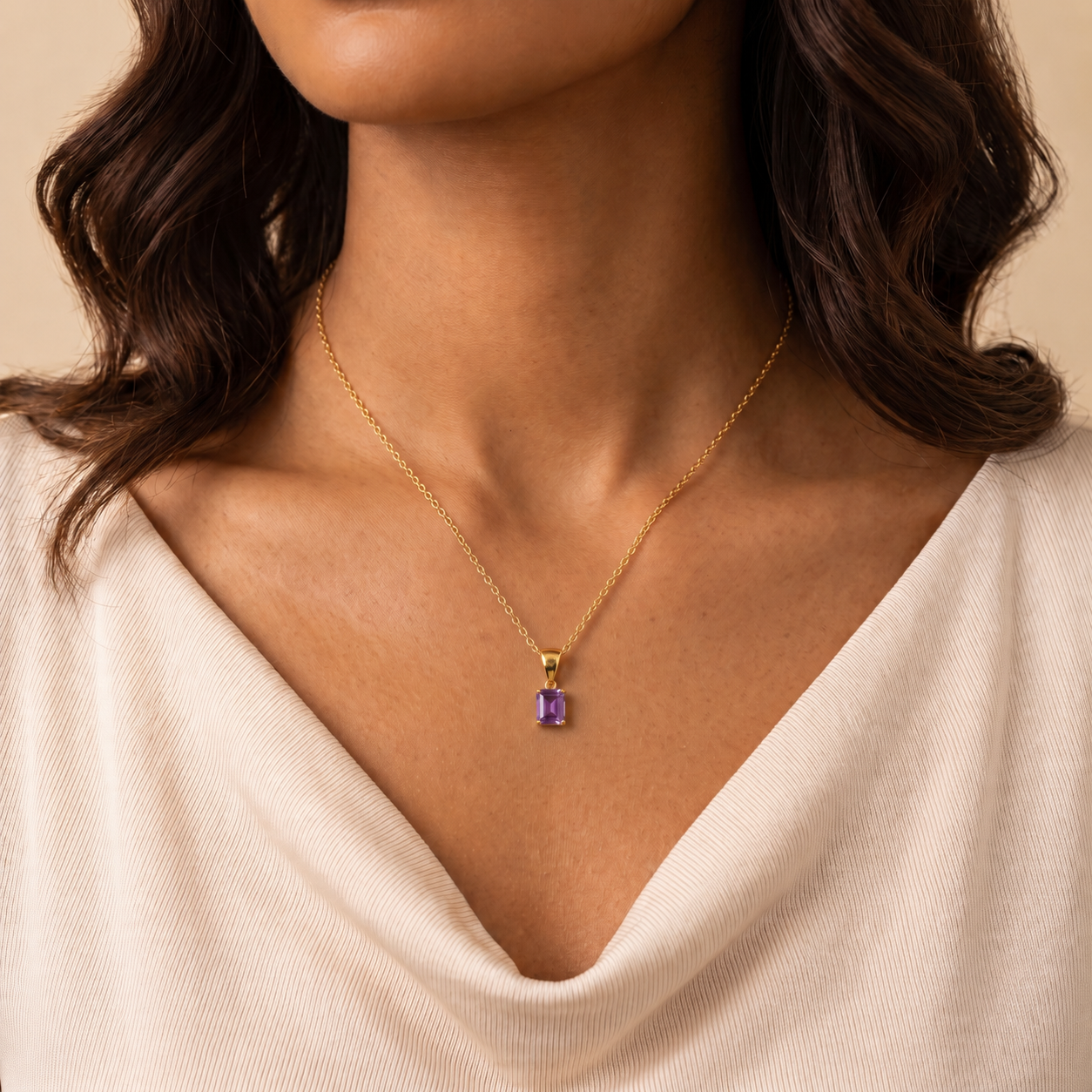 Thamani purple sapphire necklace in gold worn by a model, Juvetti London