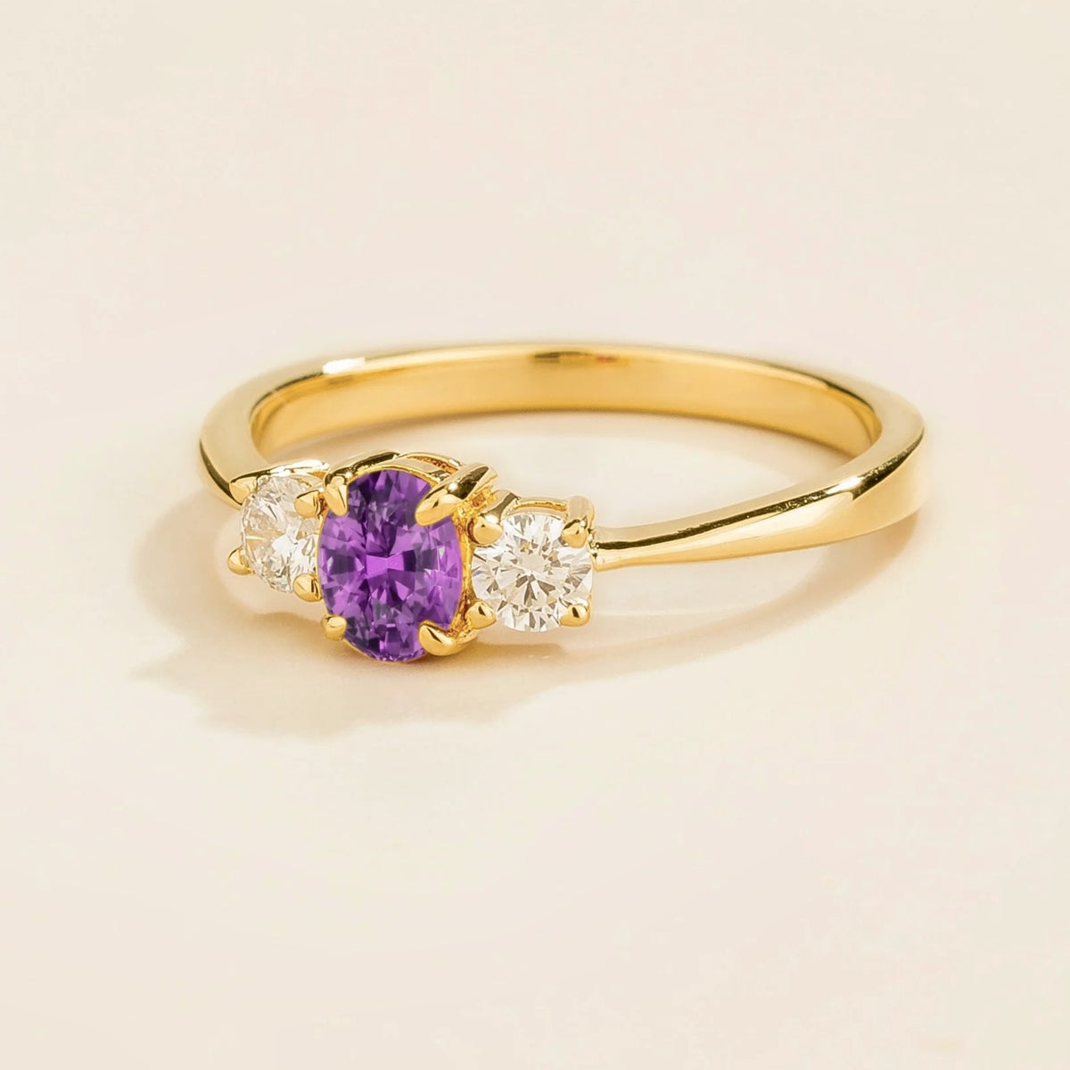 Angled view of the oval purple sapphire on the Boble ring in gold, Juvetti jewellery