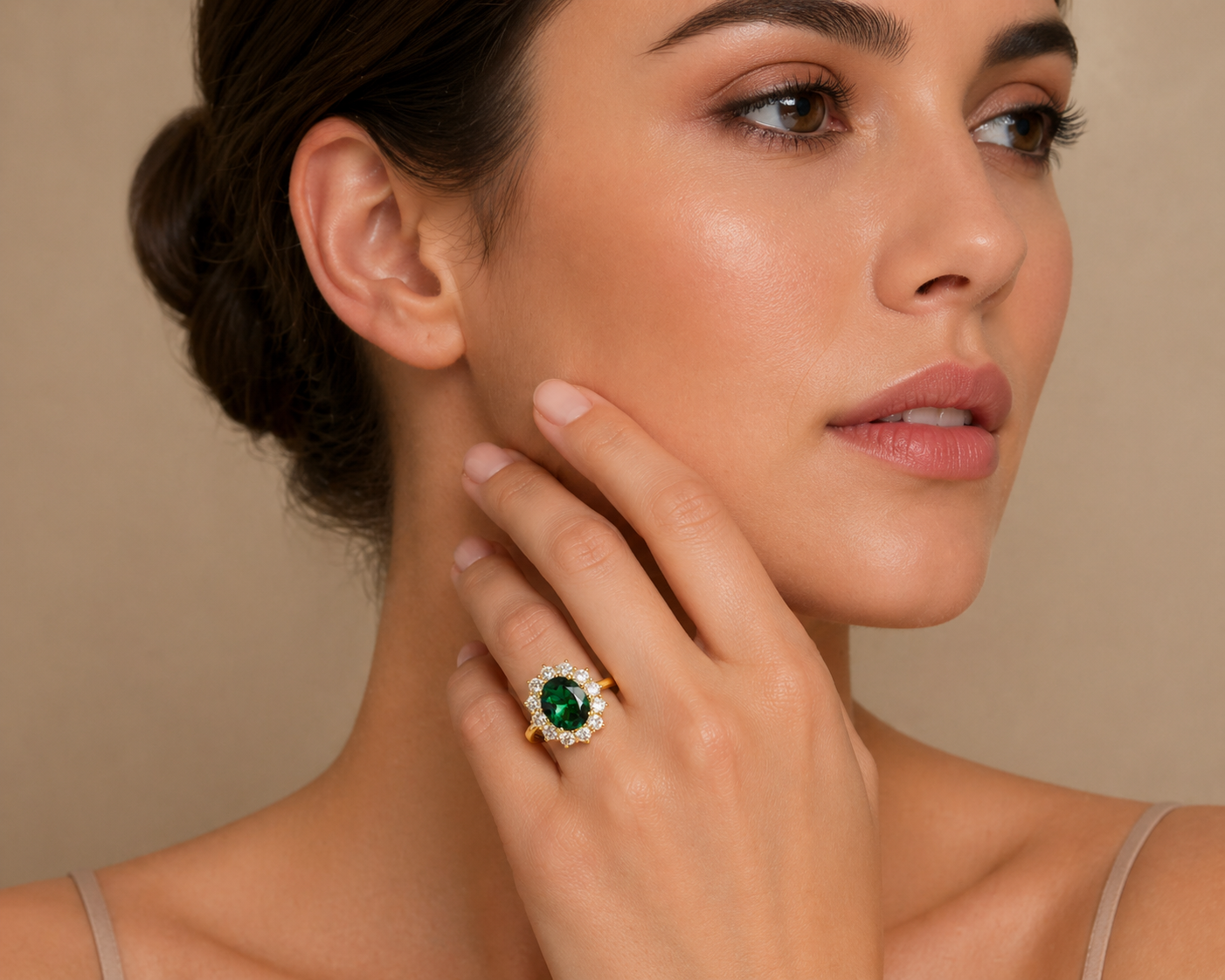 Oda purple sapphire ring in gold worn on a model's hand, Juvetti London
