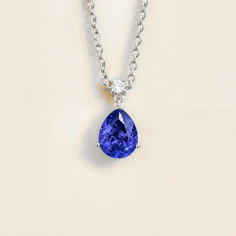 Lab-grown royal blue sapphire and diamond pear drop pendant necklace in white gold, medium – front view | Pisa by Juvetti