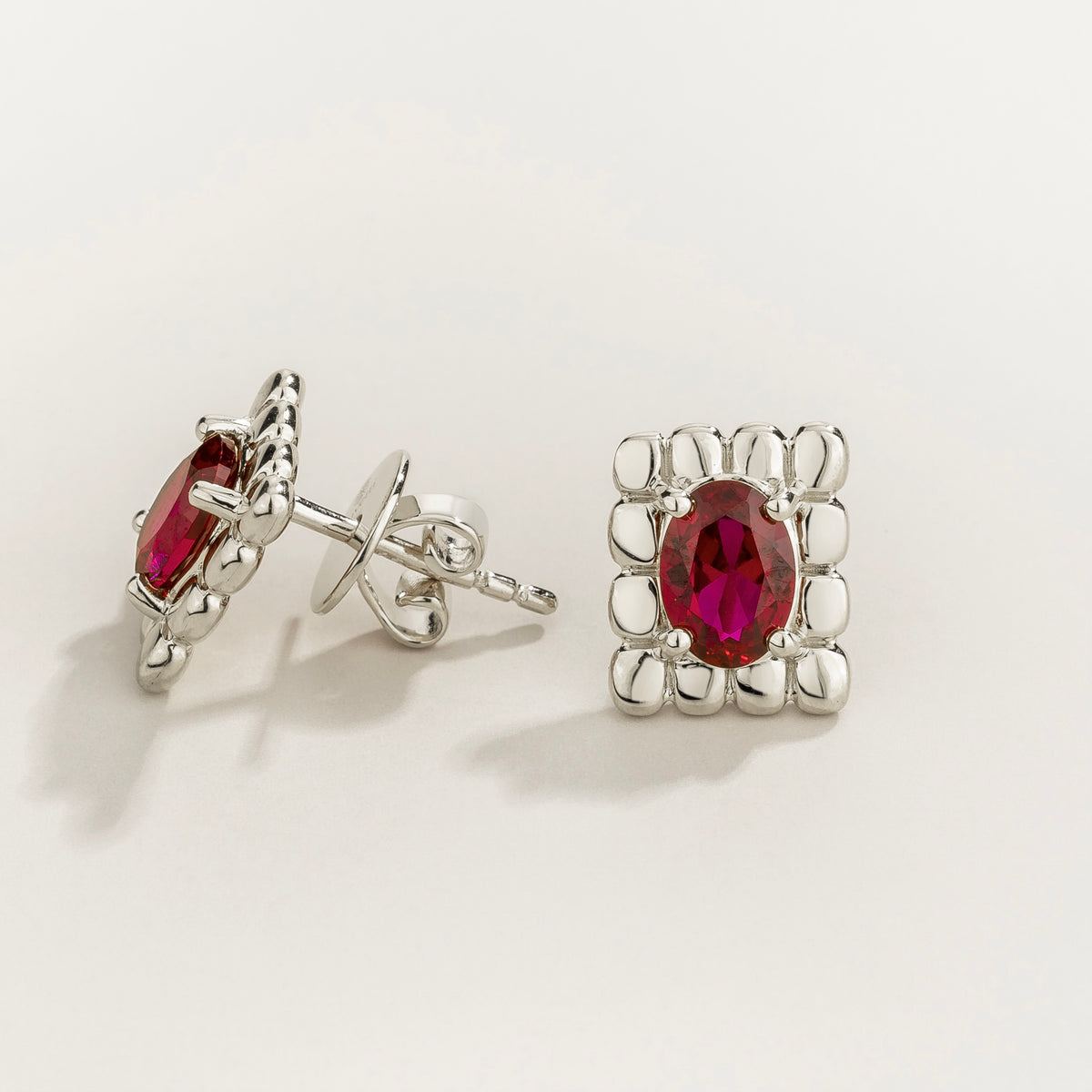 Fondi oval lab-grown ruby sculpted stud earrings in white gold – side view | Juvetti London