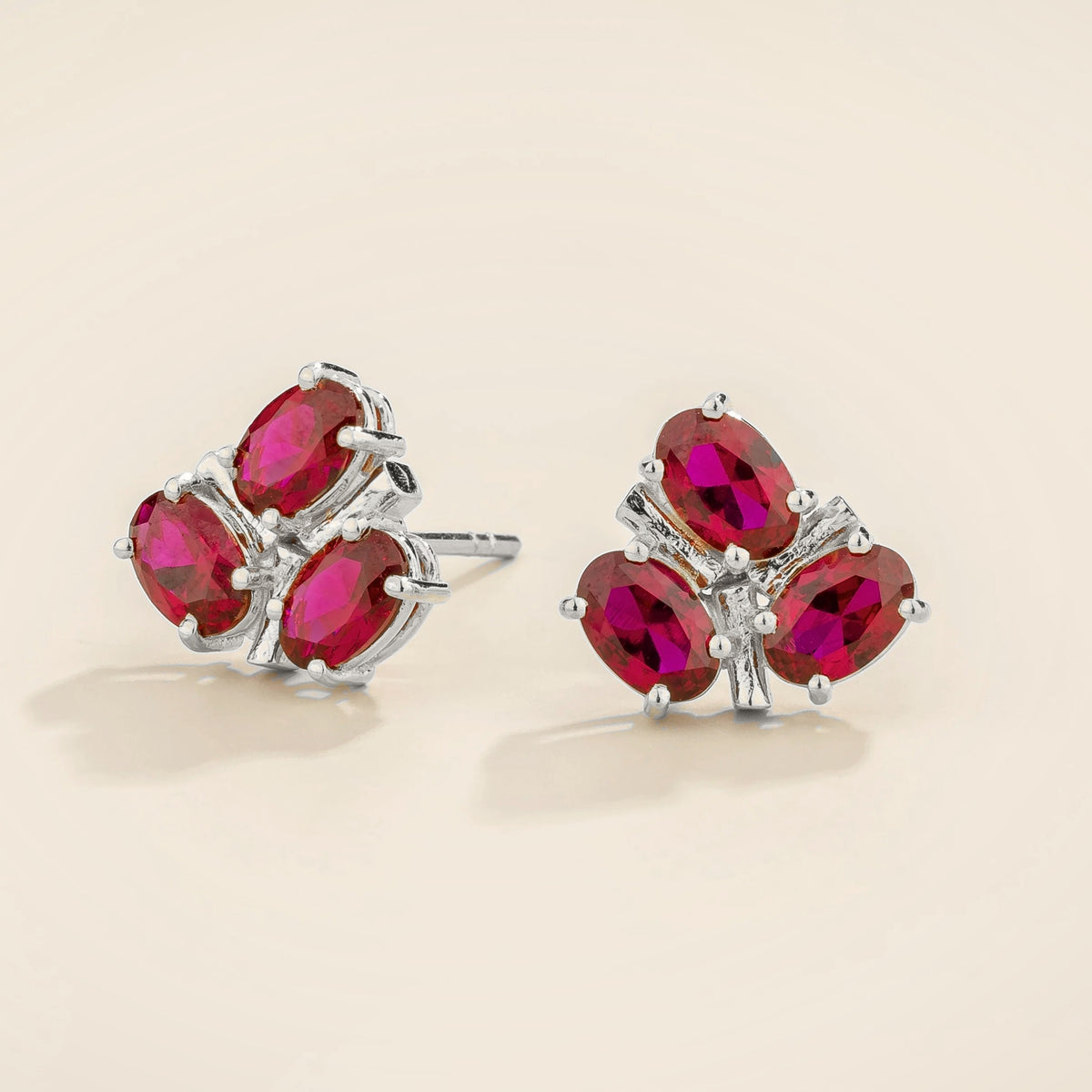 Ligna oval ruby cluster stud earrings in white gold – angle view