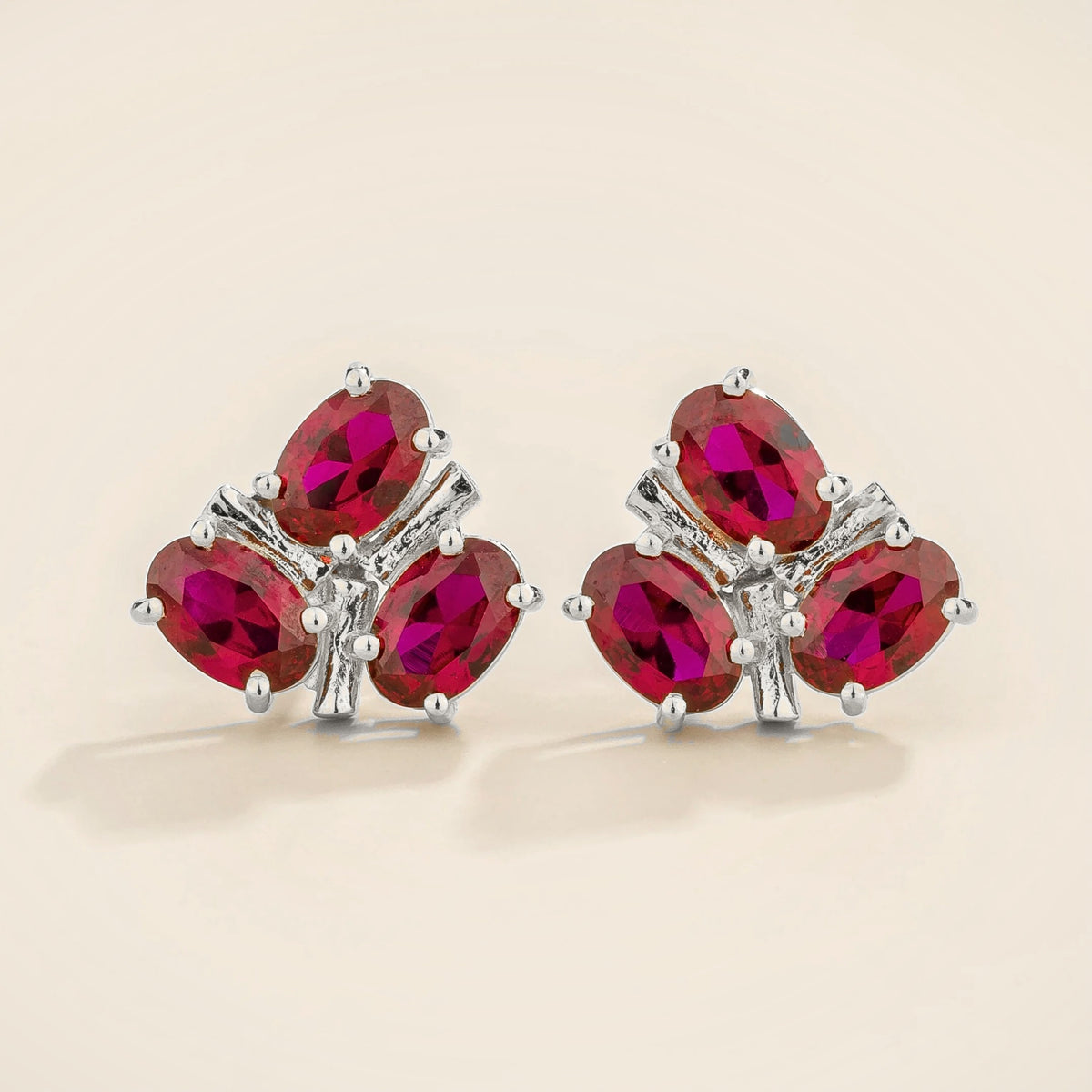 Ligna oval lab-grown ruby cluster stud earrings in white gold | Juvetti London