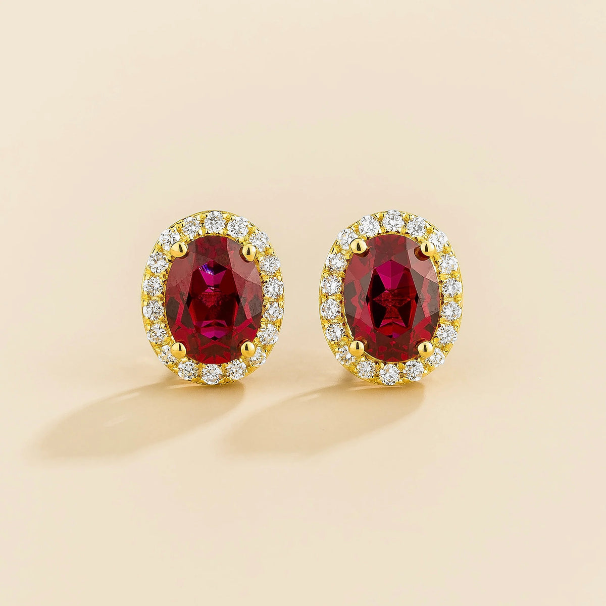 Lab-grown ruby and diamond oval halo stud earrings in gold – front view | Mina by Juvetti