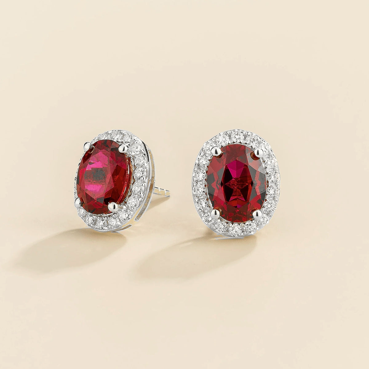 Lab-grown ruby and diamond oval halo stud earrings in white gold – side view | Mina by Juvetti