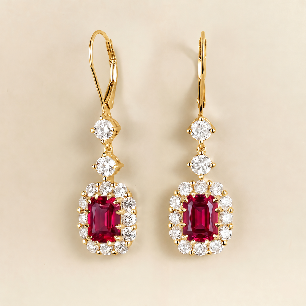 Pippa cushion-cut ruby and diamond halo drop earrings in yellow gold, angled view