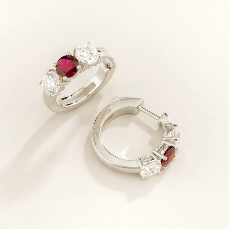 Tres Ruby & Diamond Three-Stone Huggie Hoops in White Gold – angle view