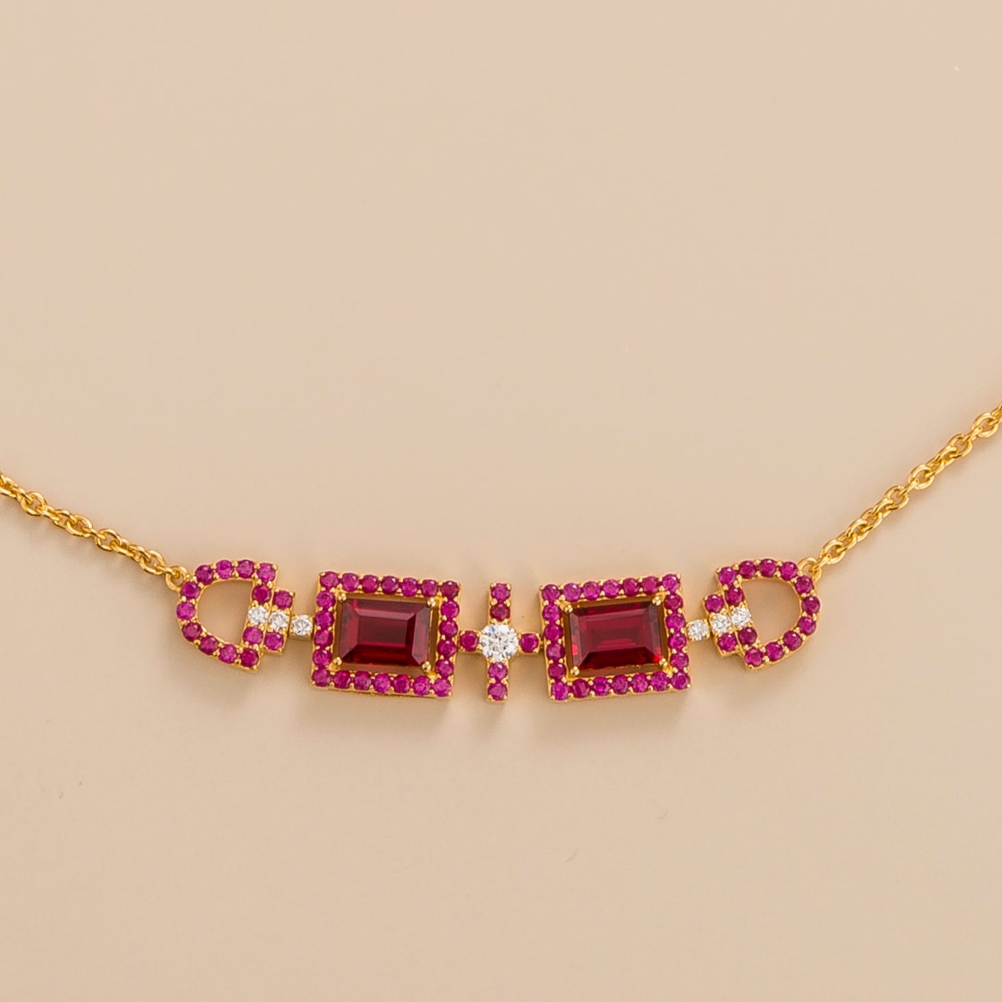 Front view of the Ciceris Ruby & Diamond Rectangle Halo Statement Gold Necklace, handcrafted by Juvetti London