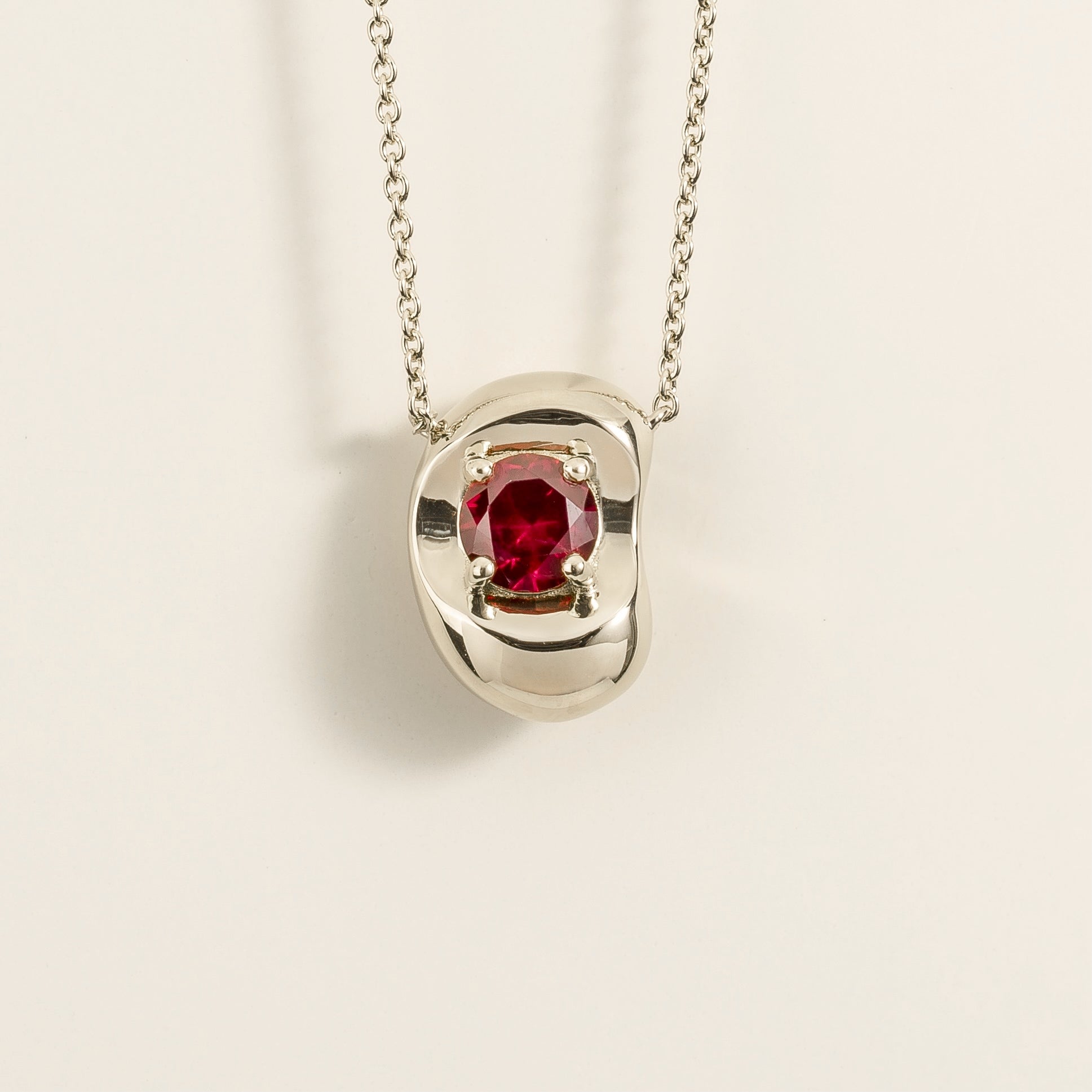 Fava Round Ruby Oval Solitaire Pendant Necklace in White Gold by Juvetti, bespoke jewellery London