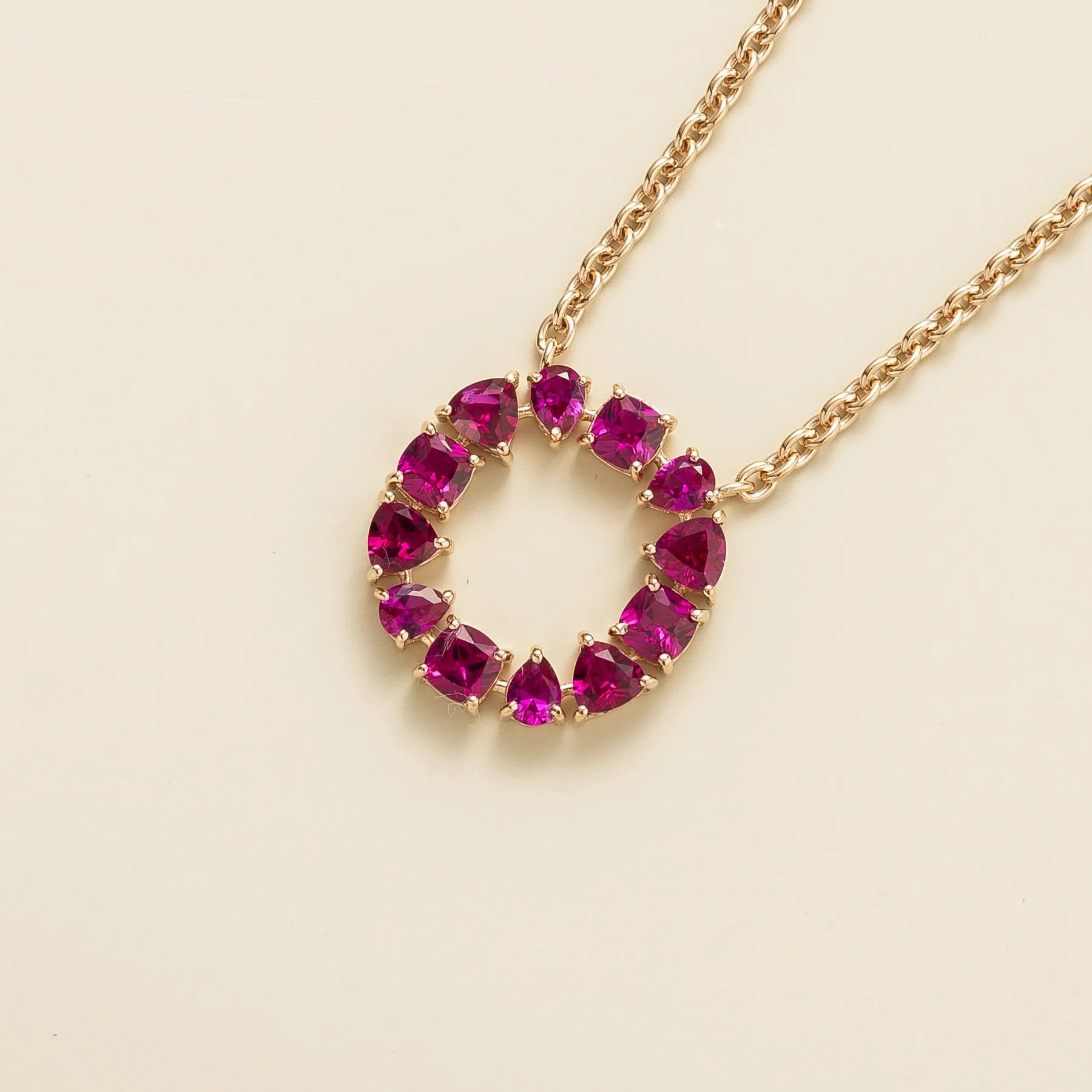Side view of the mixed cut ruby on the Glorie necklace in rose gold, Juvetti jewellery