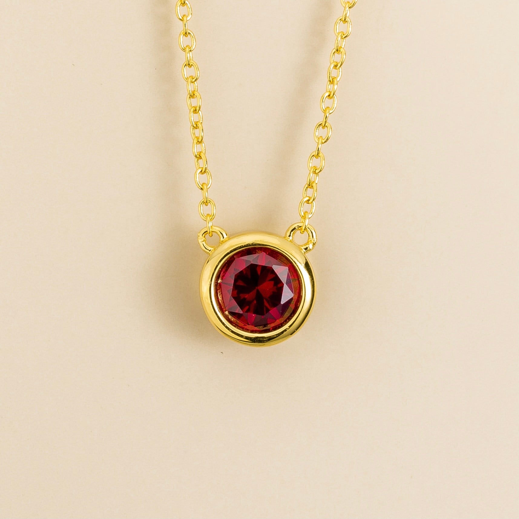 Margo Ruby Round Bazel Set Solitaire Gold Necklace by Juvetti, bespoke jewellery London