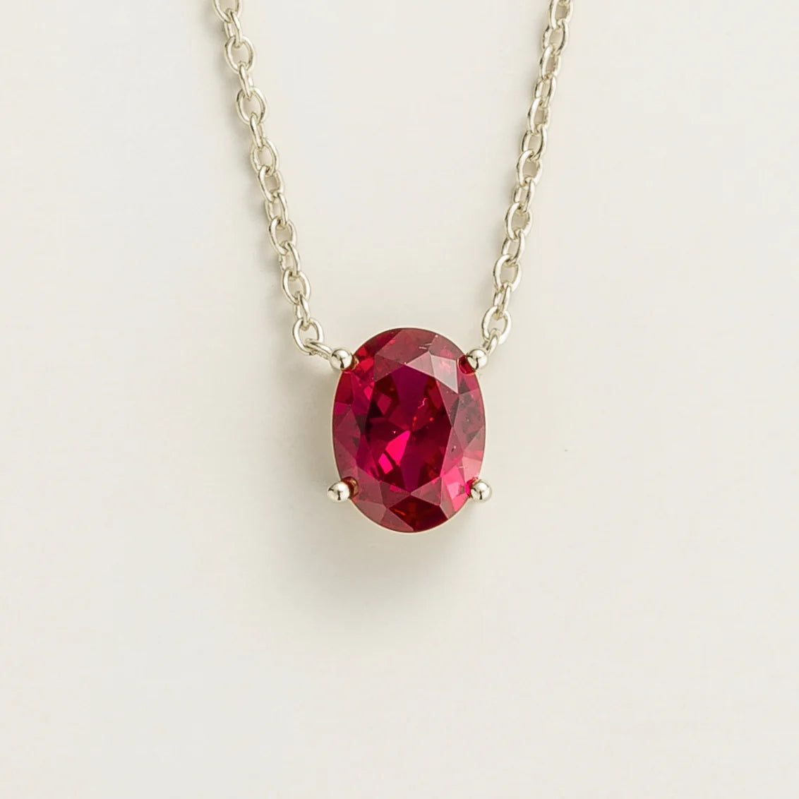 Ovo Ruby Oval Solitaire Pendant Necklace in White Gold by Juvetti, bespoke jewellery London