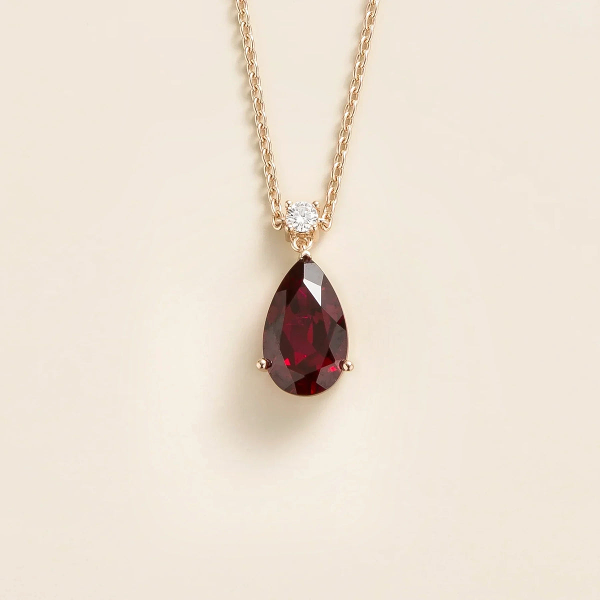 Lab-grown ruby and diamond pear drop pendant necklace in rose gold, large – angled view | Pisa by Juvetti