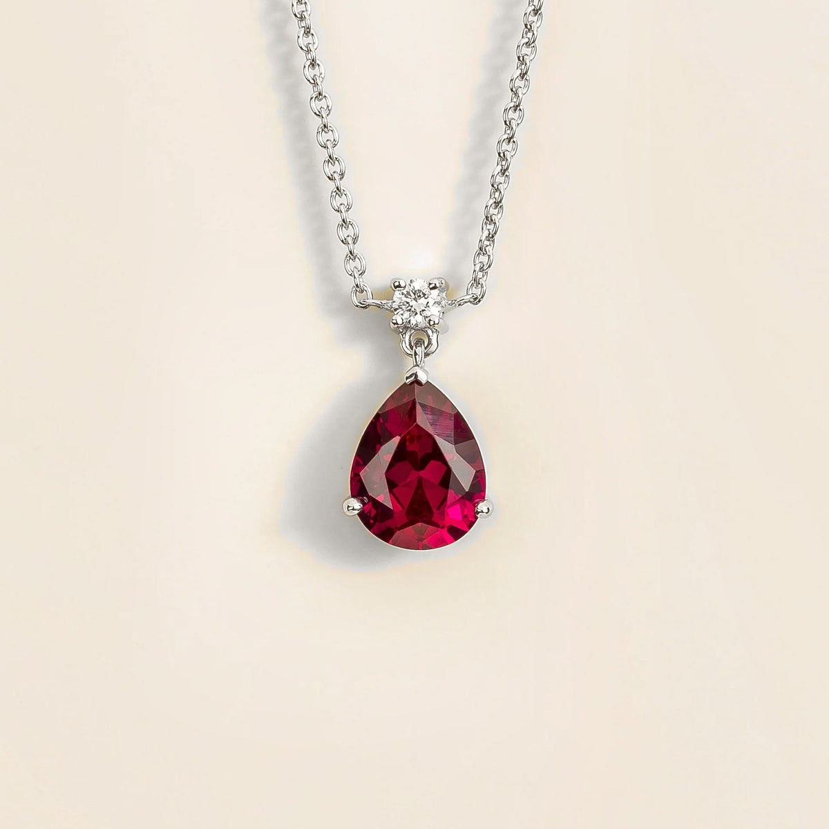 Lab-grown ruby and diamond pear drop pendant necklace in white gold, medium – front view | Pisa by Juvetti