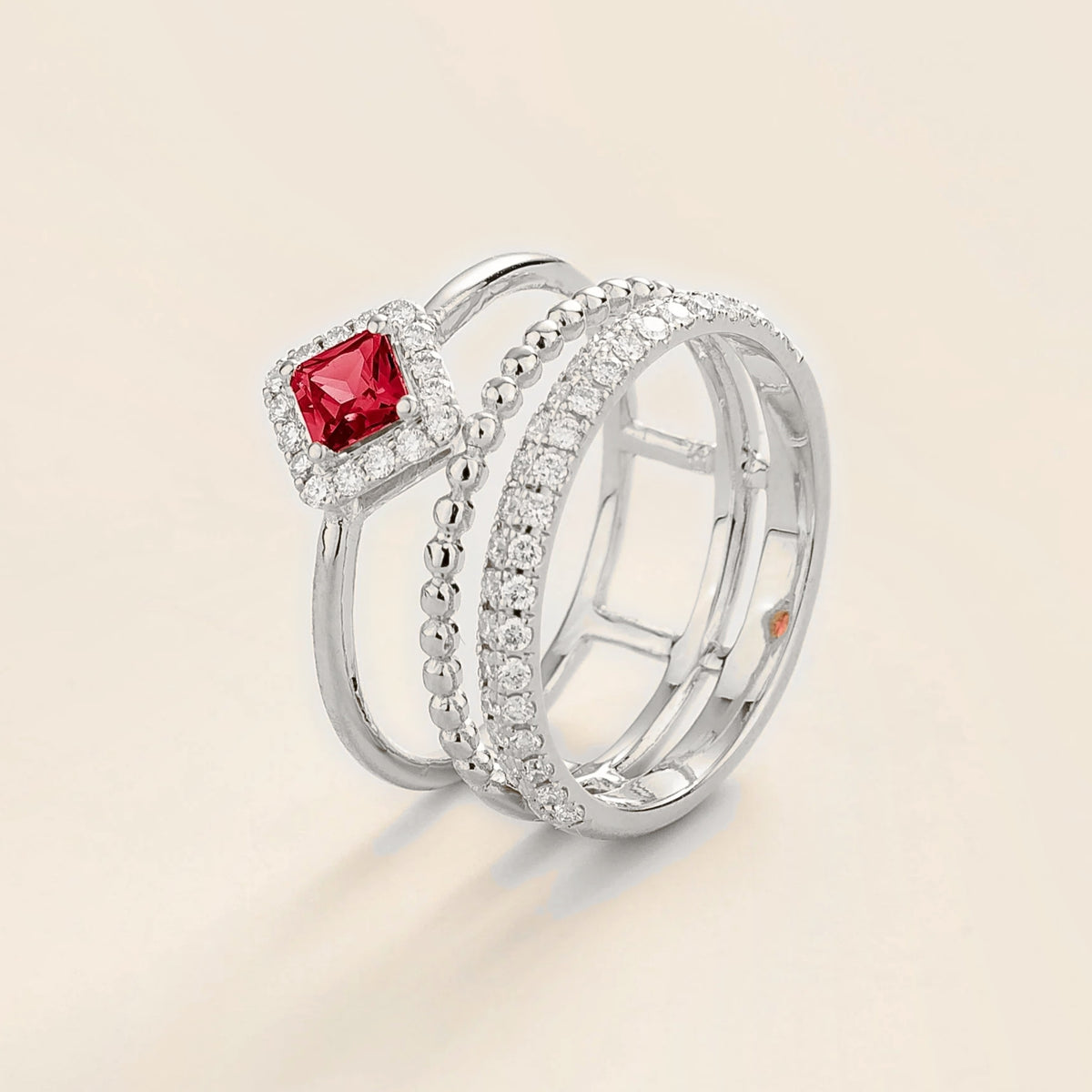 Amici triple-band stacking ring in white gold, princess-cut lab-grown ruby in a diamond halo with beaded and pavé bands, side view | Juvetti London