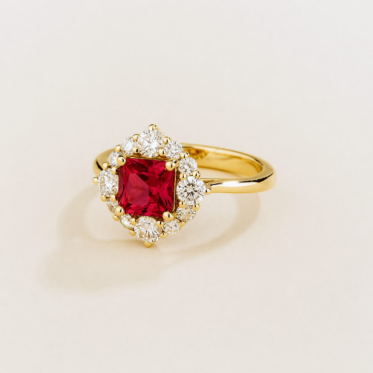 Tuli cushion-cut lab-grown ruby and diamond halo ring in gold – angle view | Juvetti London
