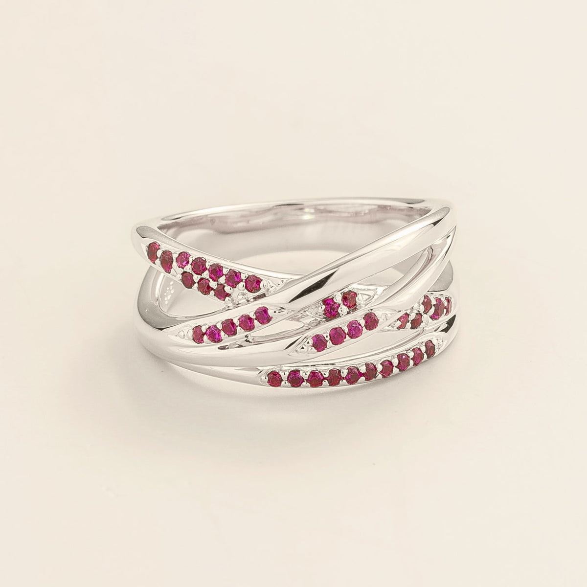 Val multi-row crossover band ring with lab-grown rubies in white gold – front view | Juvetti London