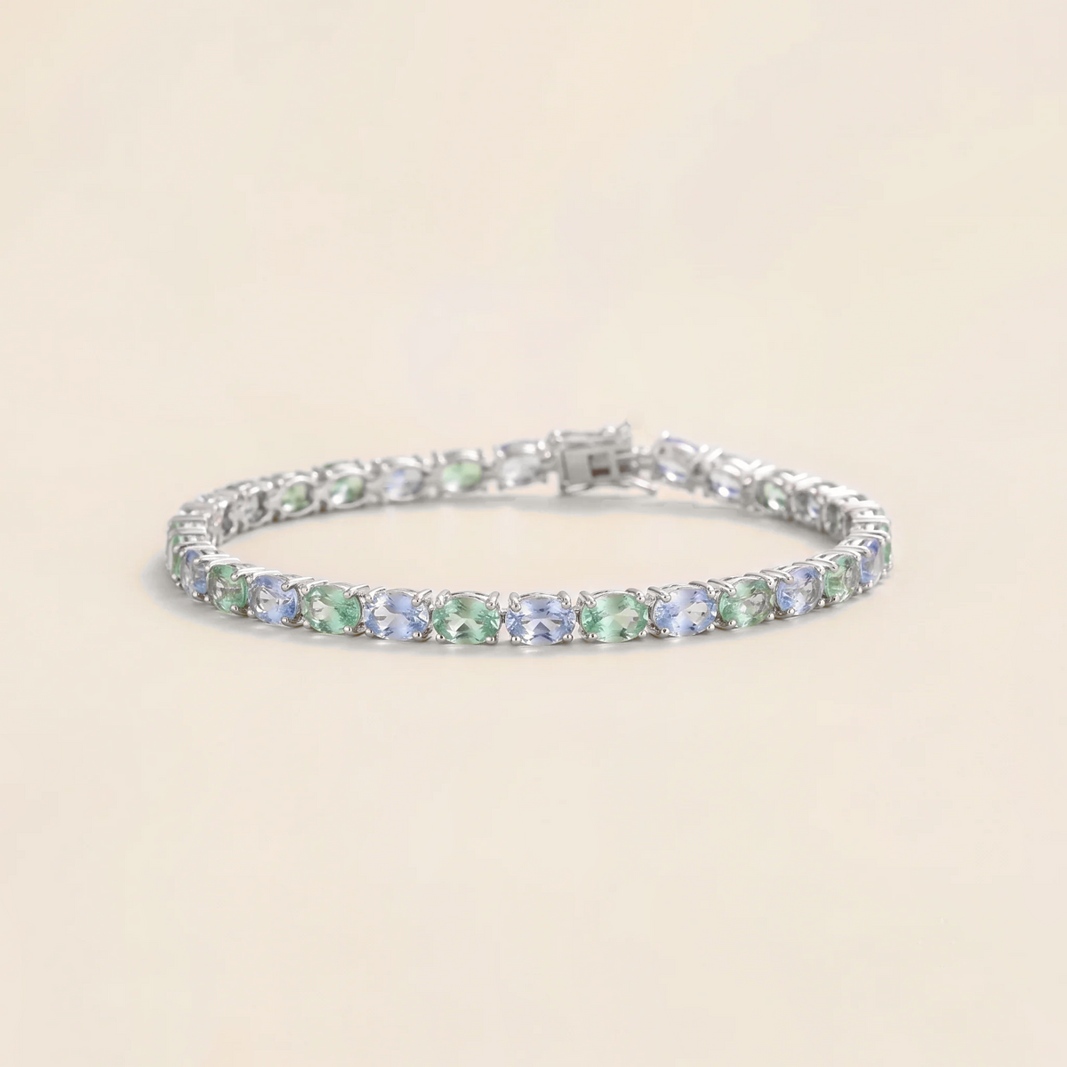 Salto pastel blue and green sapphire oval tennis bracelet in white gold | Juvetti