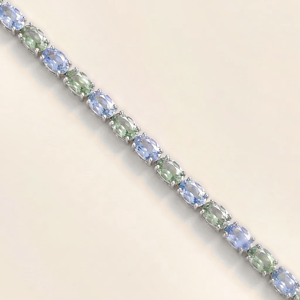 Salto pastel blue and green sapphire oval tennis bracelet in white gold
