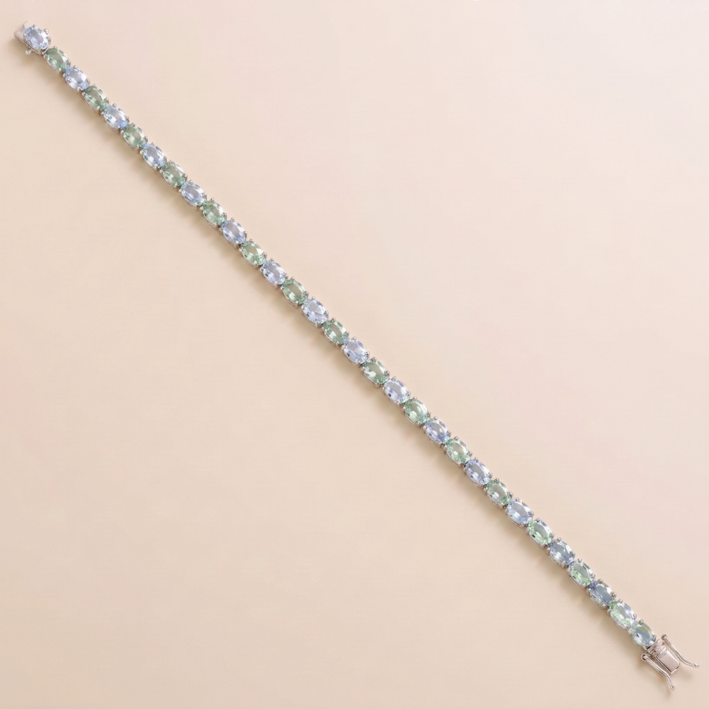 Oval lab-grown pastel blue and green sapphire tennis bracelet in white gold | Juvetti London.