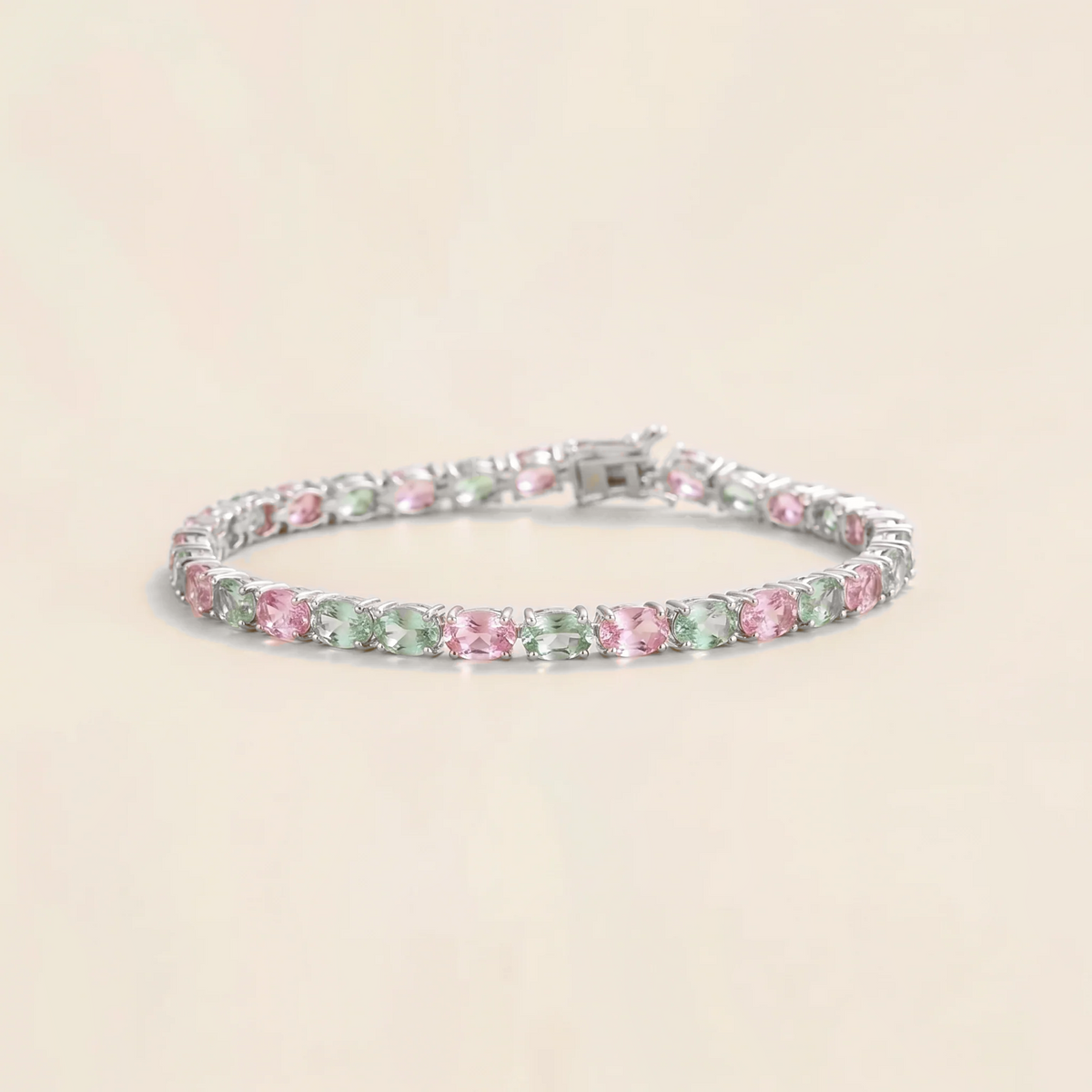 Salto pastel pink and green sapphire oval tennis bracelet in white gold | Juvetti