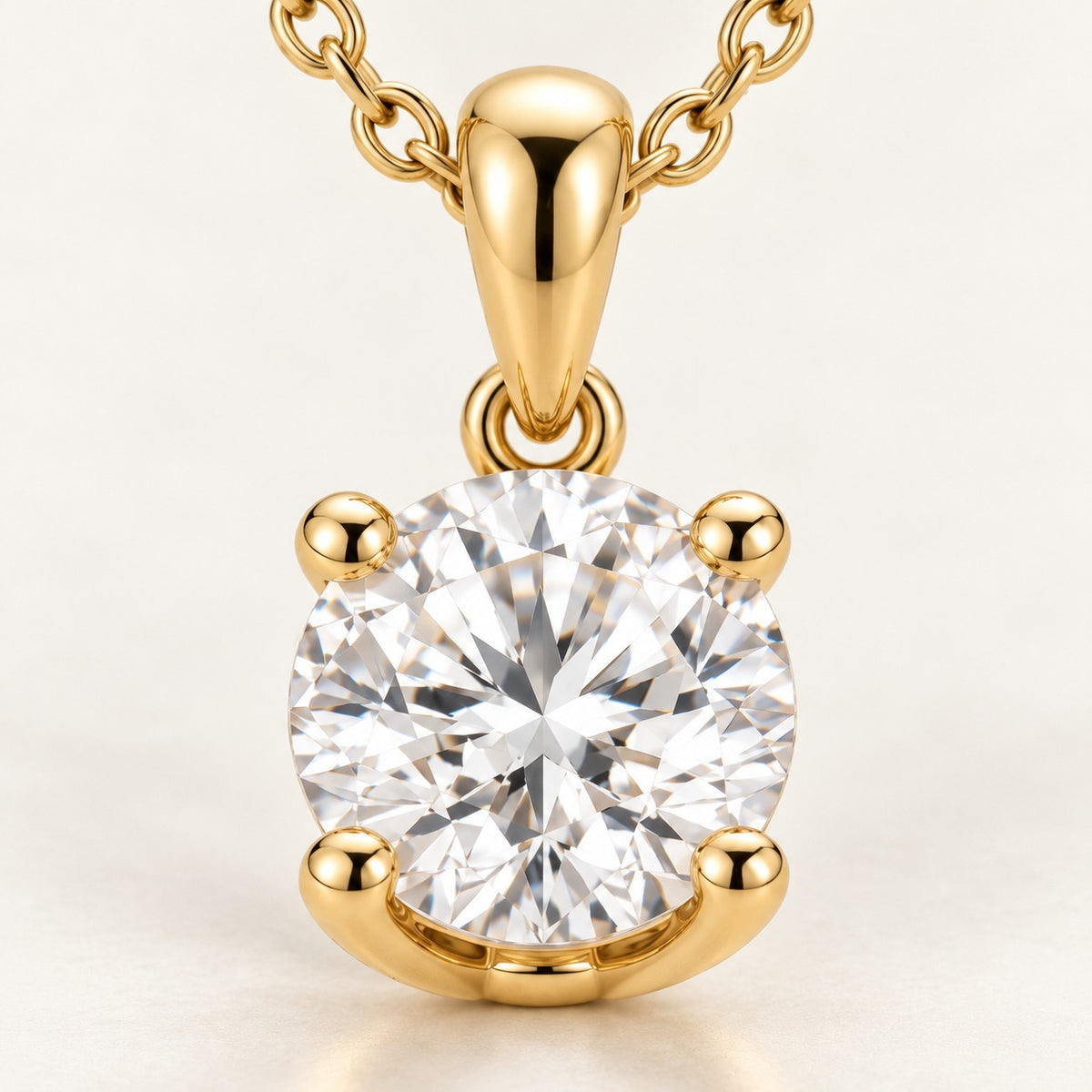 Close-up of the solitaire pendant setting: four claws, bail and chain