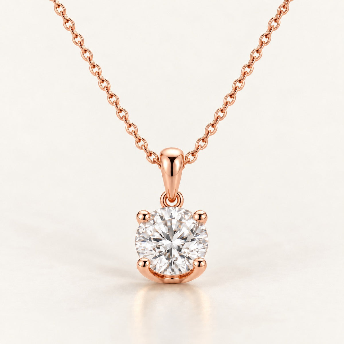 Solitaire pendant setting in rose gold, shown with a 1 ct round diamond
