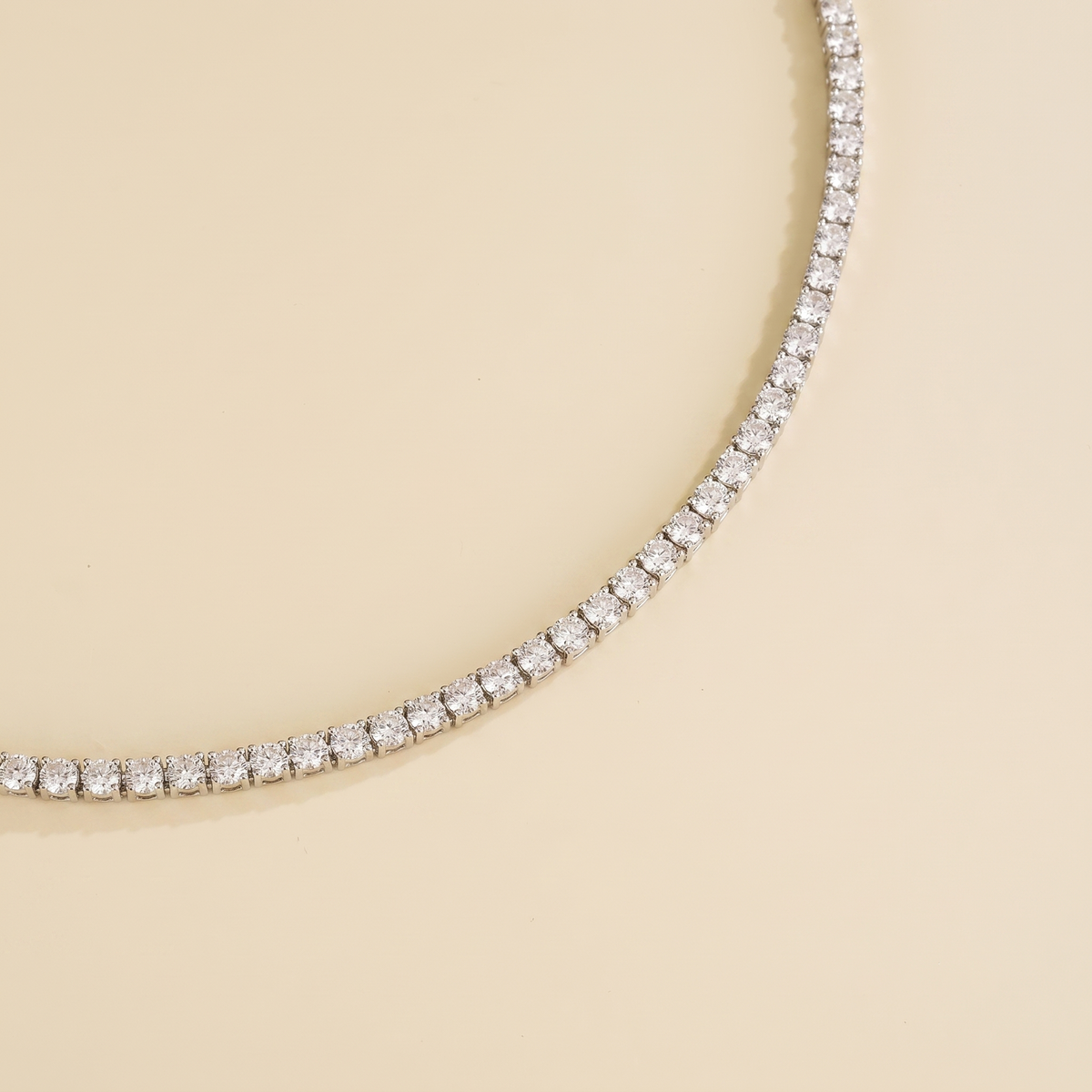 Stacy diamond round tennis necklace in white gold, angle view